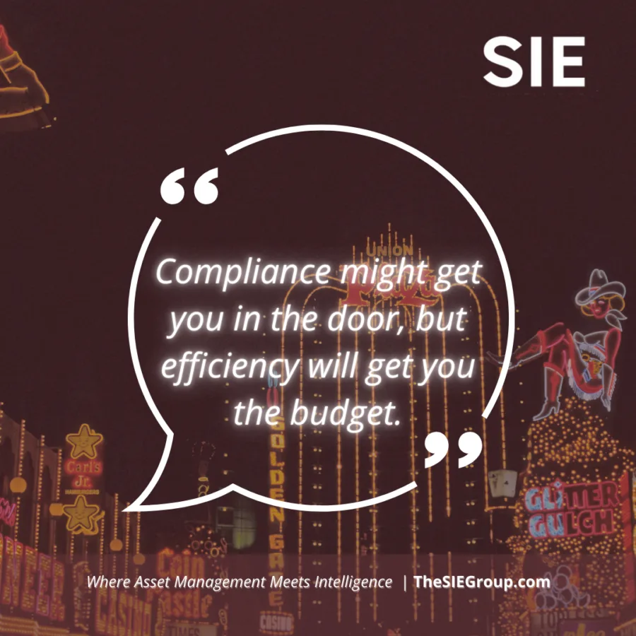 SIE Group business efficiency quote with Fremont Street Las Vegas neon lights background - 'Compliance might get you in the door, but efficiency will get you the budget.'